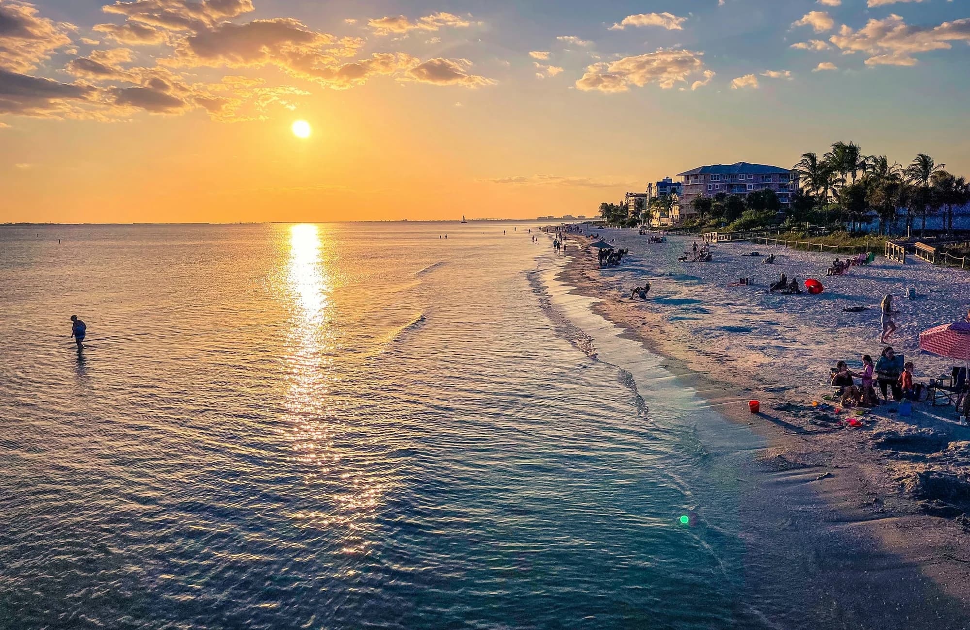 A warm sunset over Fort Myers Beach and the Gulf shoreline.