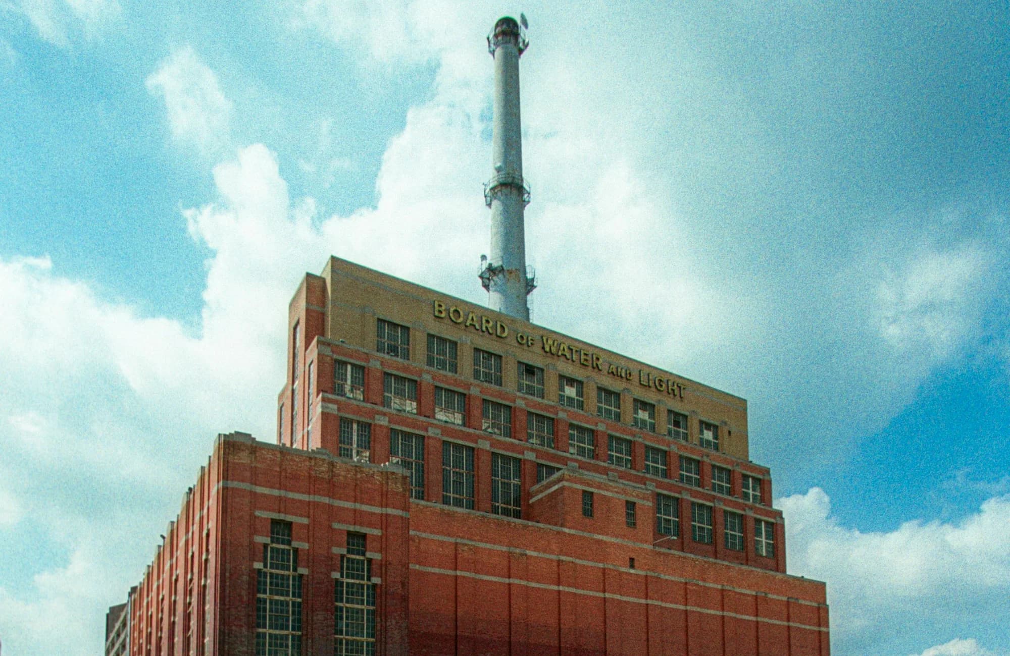 The Lansing Board of Water and Light building beneath a blue sky.