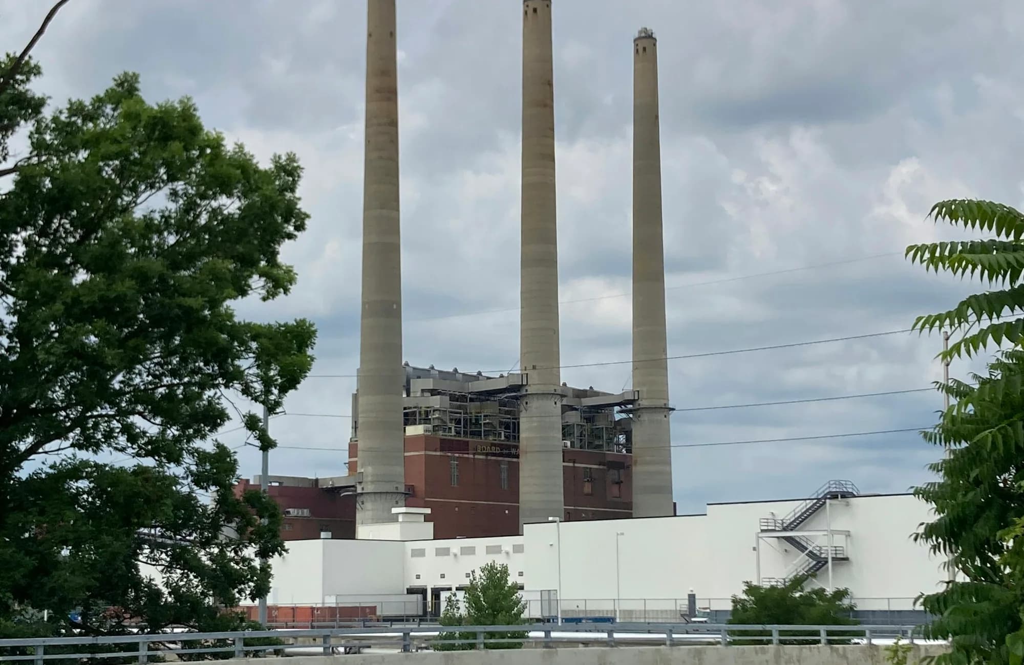 Lansing's industrial skyline beneath an overcast sky.
