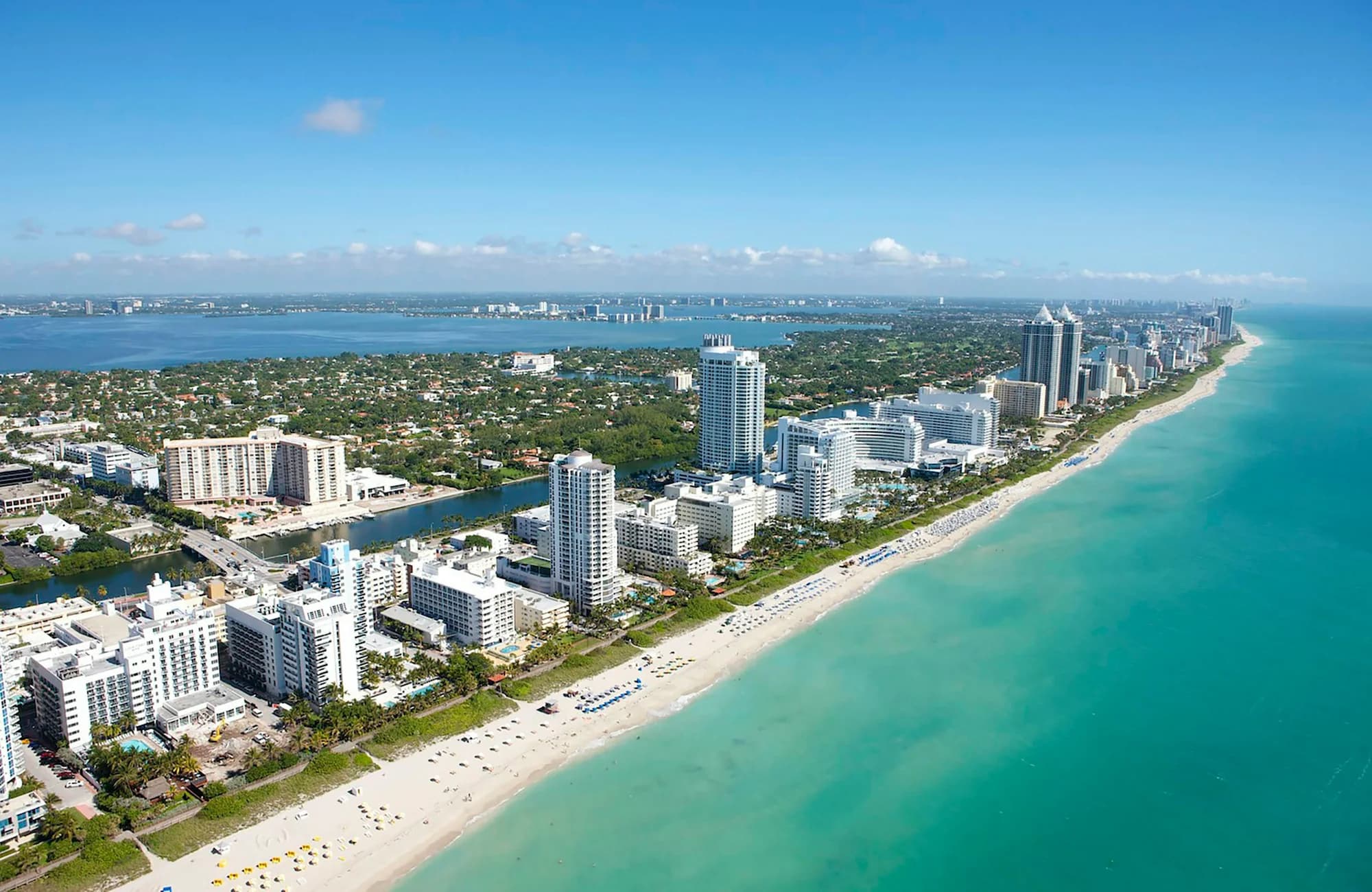 Miami Beach towers and the Atlantic coastline seen from above.