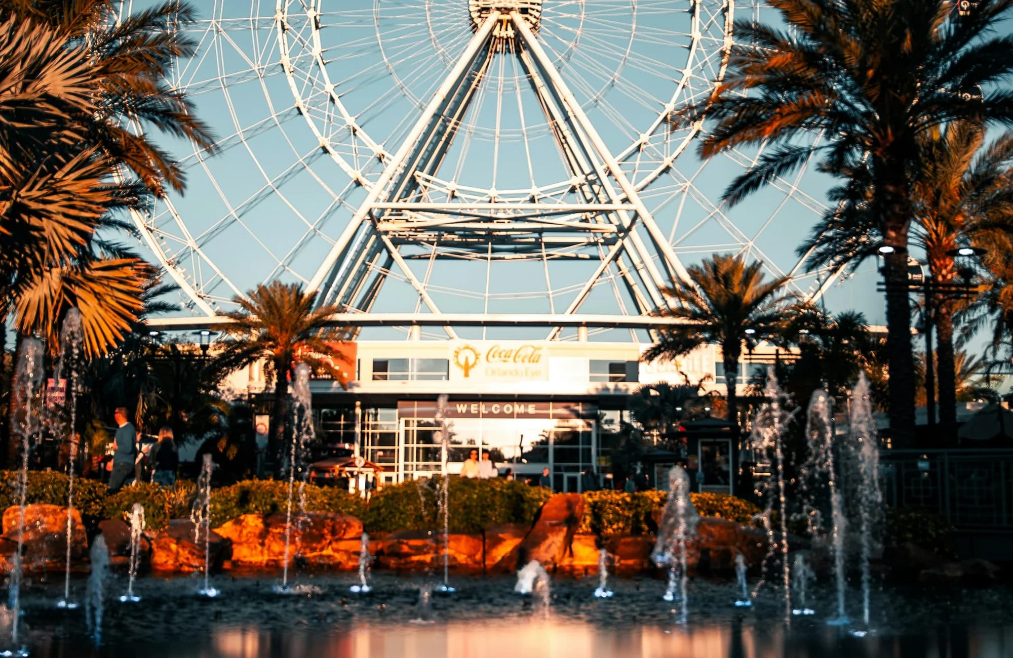 The Orlando Eye reflected in the water near sunset.